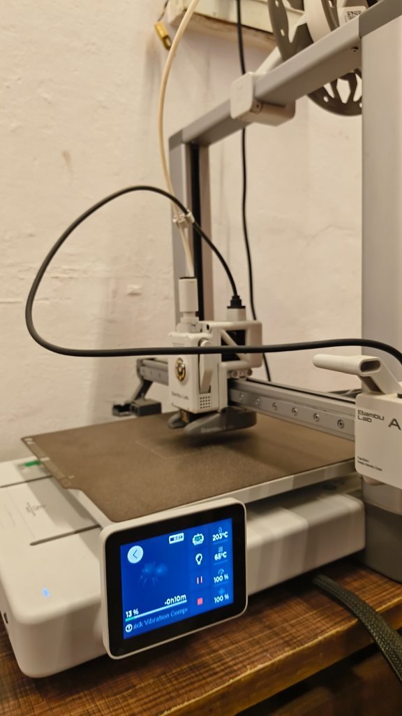 A 3D printer in the school lab partway through printing a student model