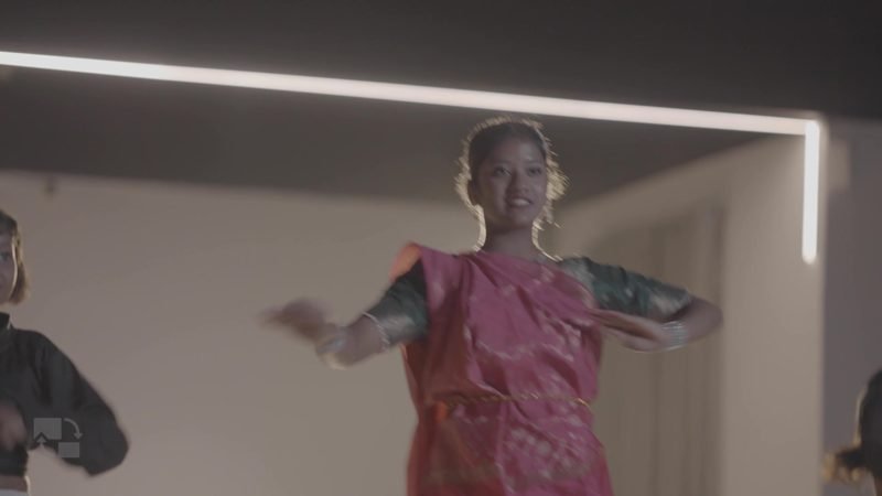 Student performing classical dance in traditional costume