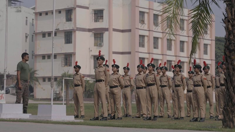 NCC cadets standing in line in front of the school building, Rohania