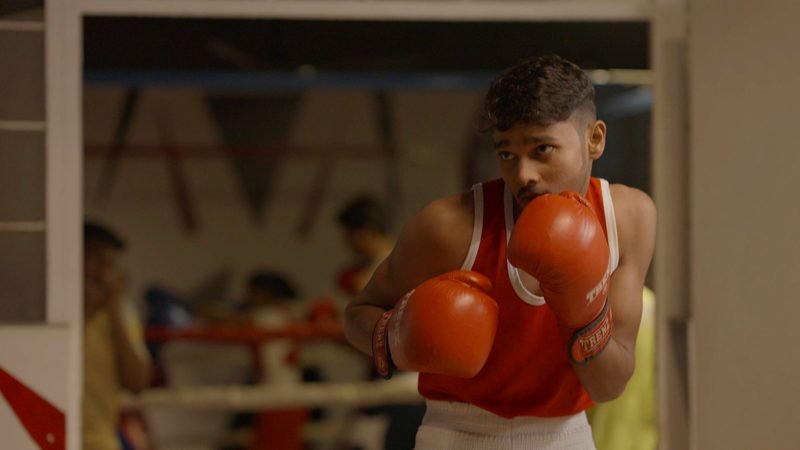 A student training in the boxing gym, Rohania