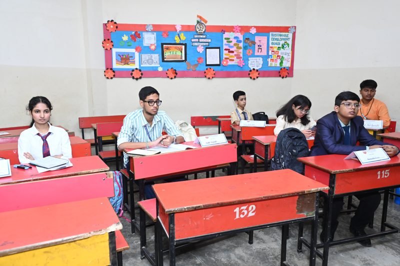 Students in a Model UN committee session with country placards at Dalimss Sunbeam School, Varanasi