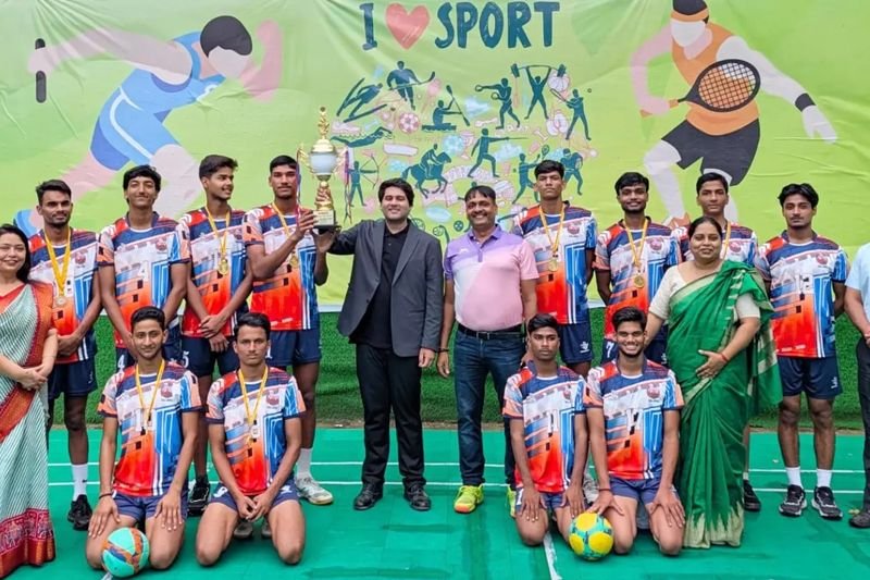 The Dalimss Sunbeam volleyball team with their trophy